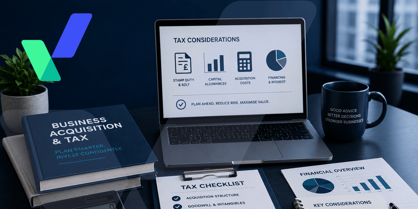 Professional business tax planning workspace featuring a laptop with financial charts, calculator, tax planning documents, notebook and business reports on a modern blue-toned desk with subtle corporate branding and a blurred office background.